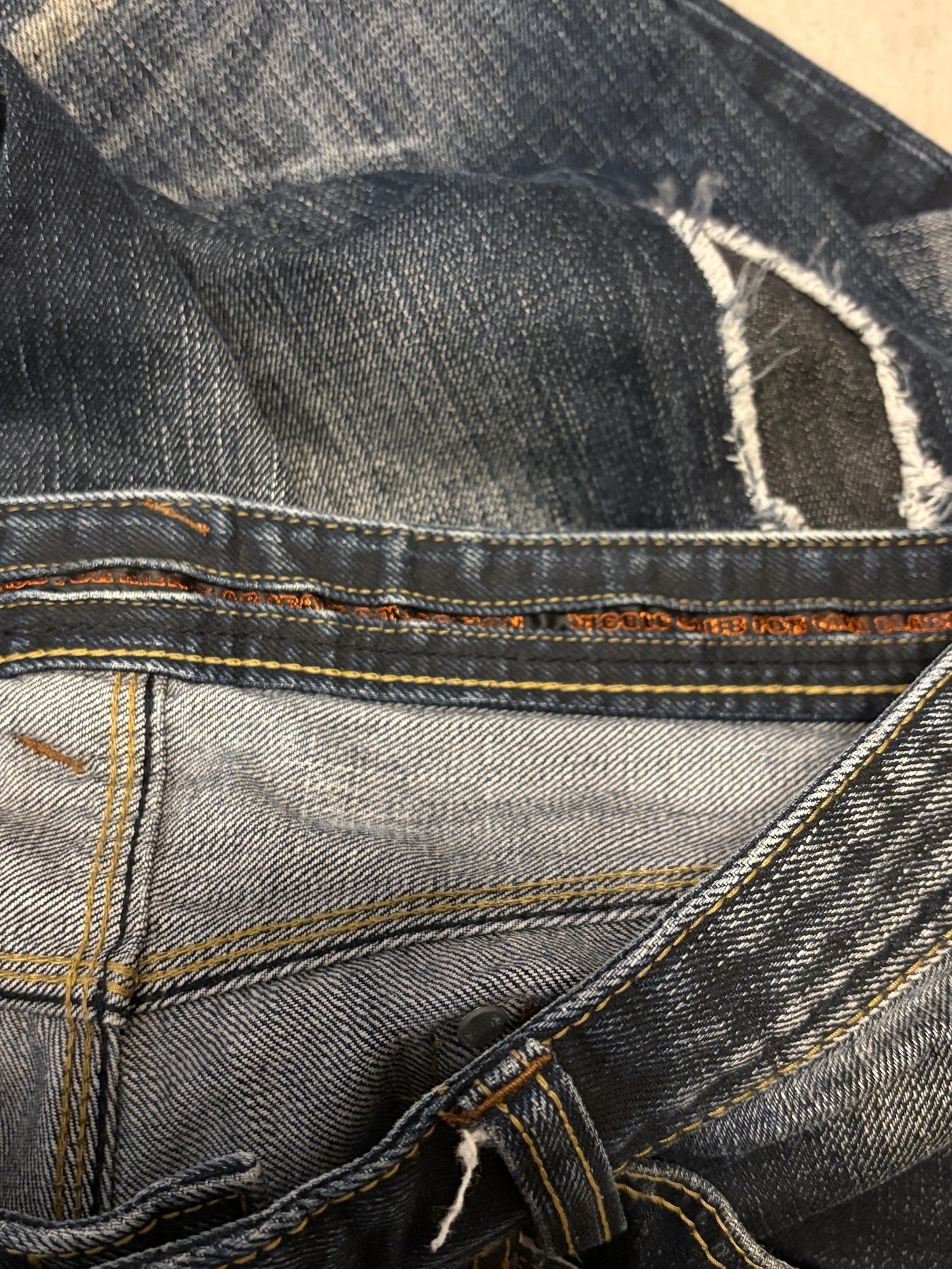 Nicole Club distressed patchwork claw mark bootcut denim jeans