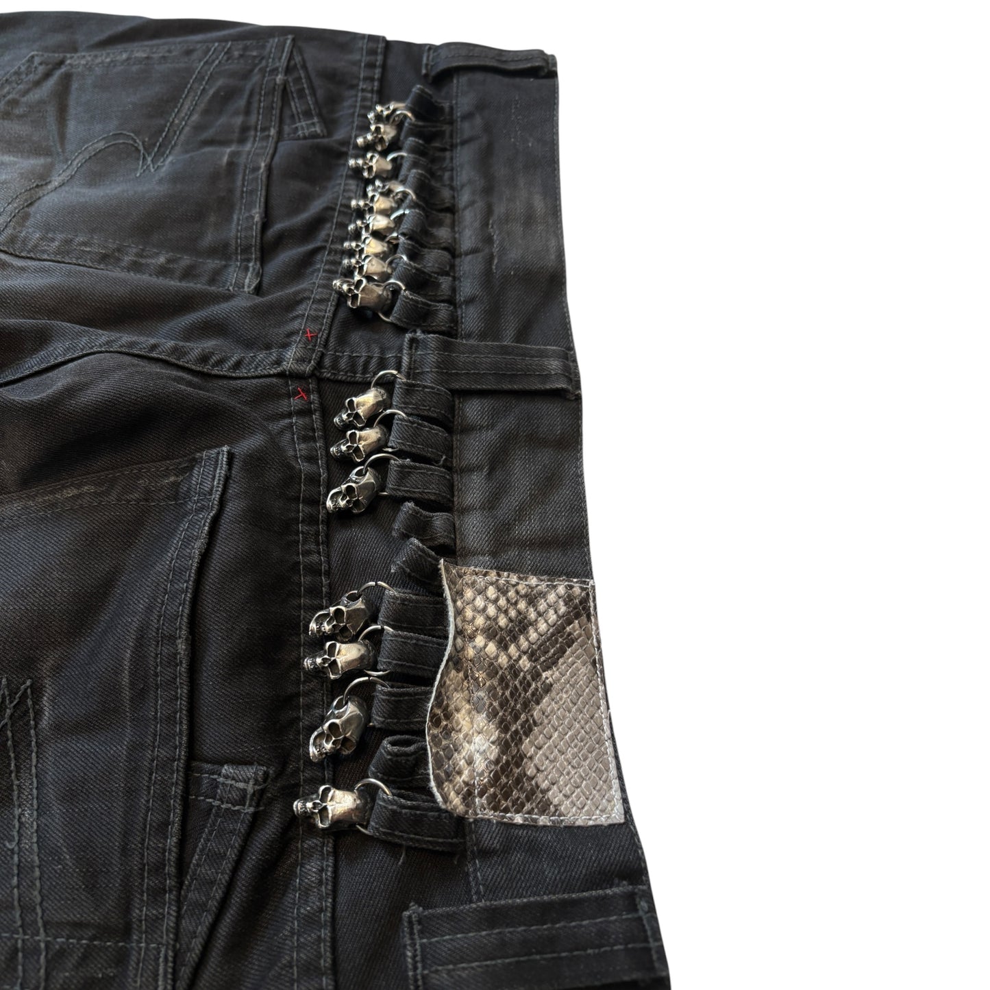 Semantic Design metal skull belt streaked whiskered denim jeans