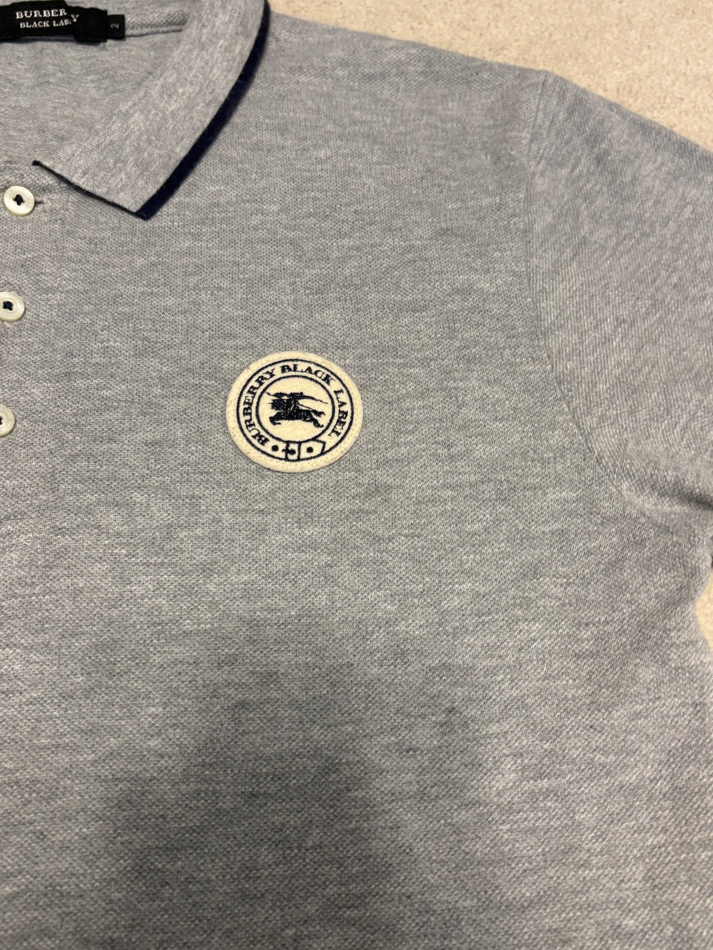 Burberry Black Label grey striped polo w/ embroided badge