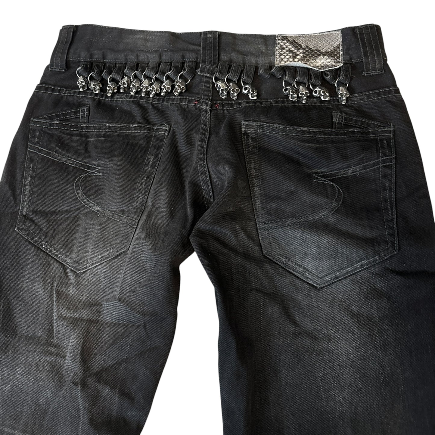 Semantic Design metal skull belt streaked whiskered denim jeans