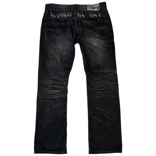 Semantic Design metal skull belt streaked whiskered denim jeans