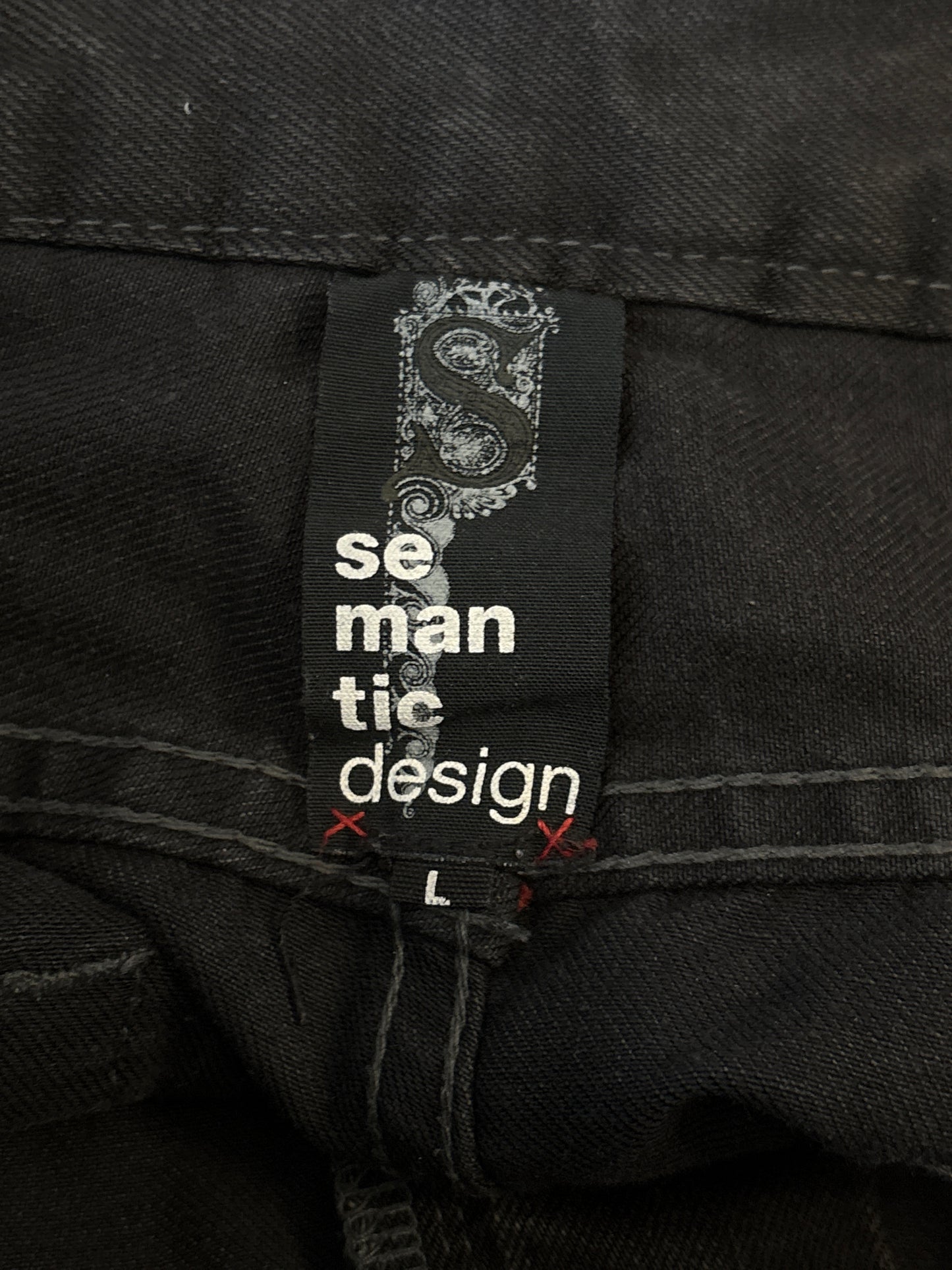 Semantic Design metal skull belt streaked whiskered denim jeans