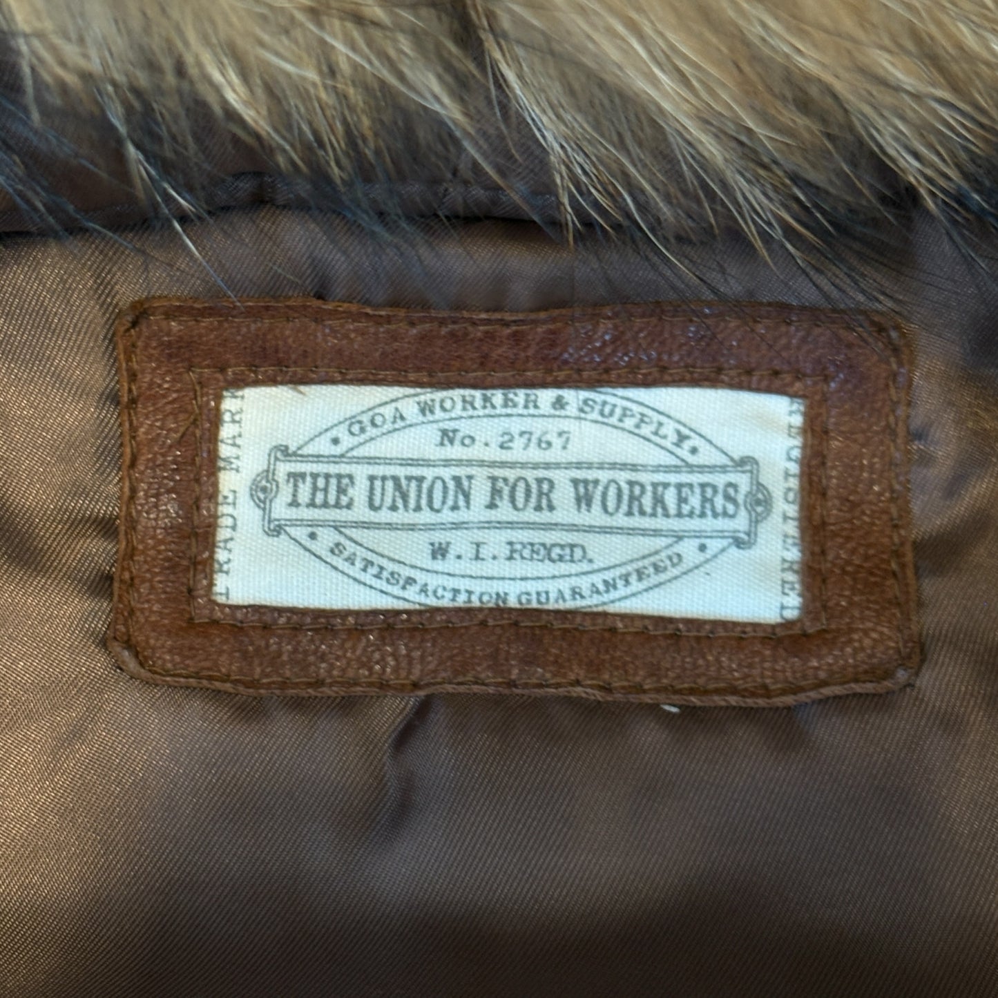 Goa tan lambskin leather flight jacket w raccoon fur hood